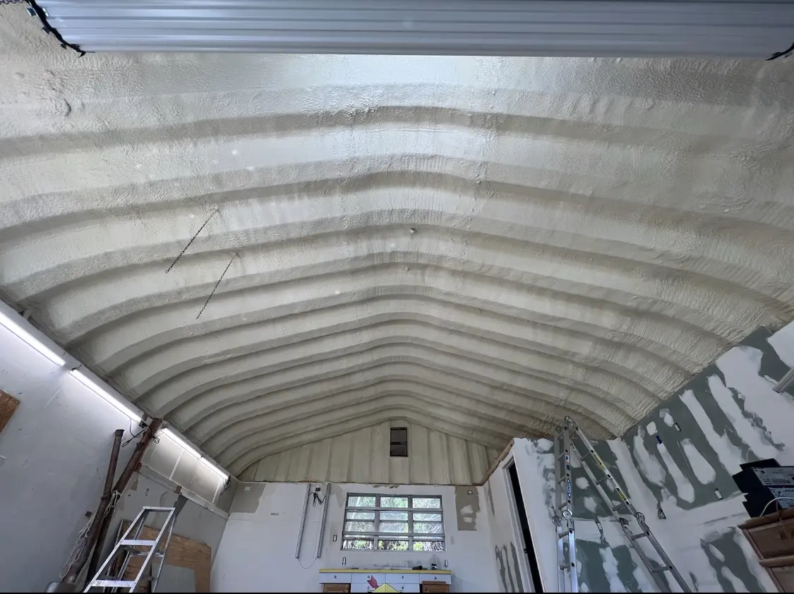 Spray polyurethane foam applied to the underside of a metal roof deck in Ellenton